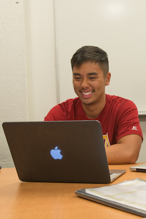 young male student at computer