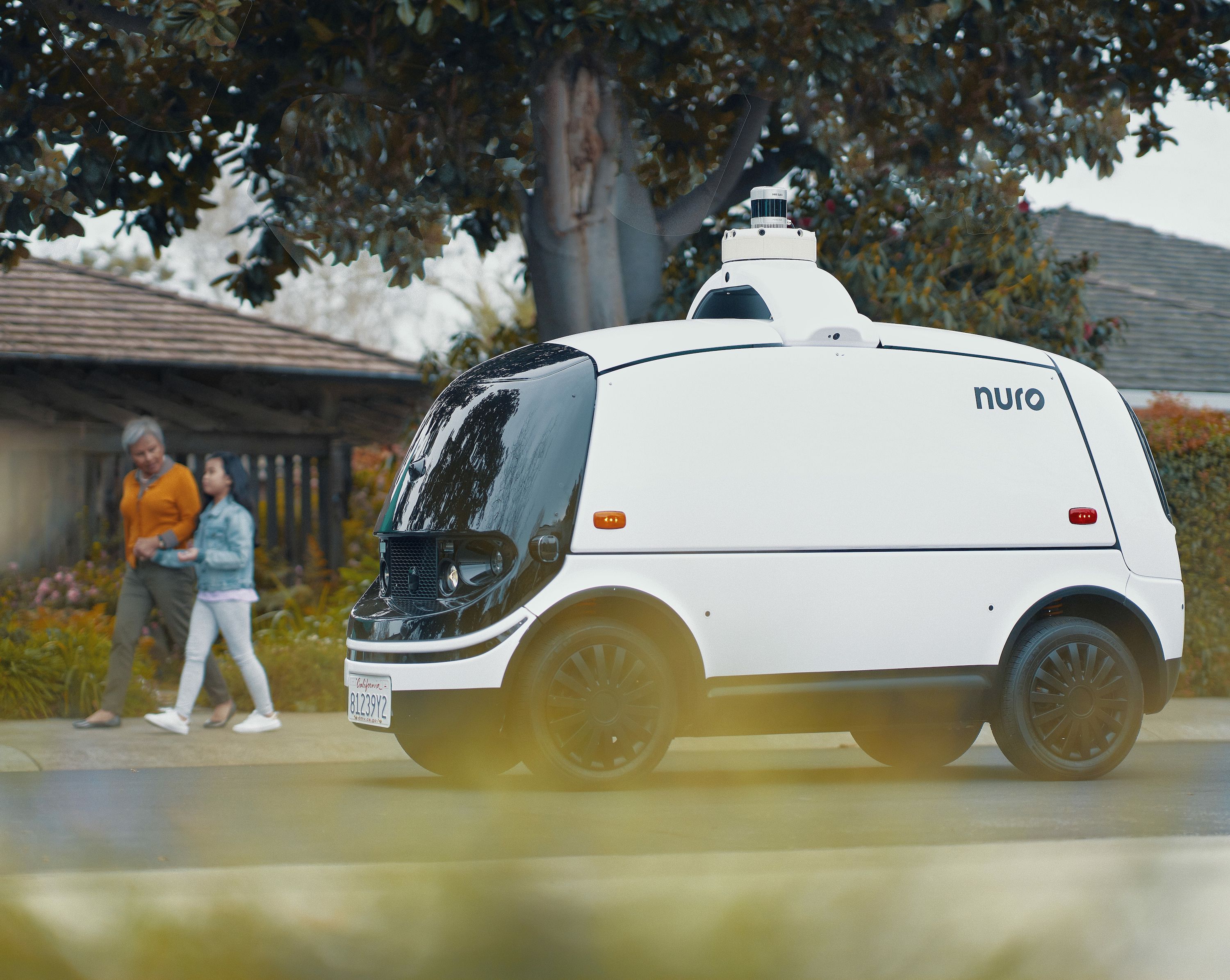 Nuro R2 autonomous vehicle on a street in the suburbs
