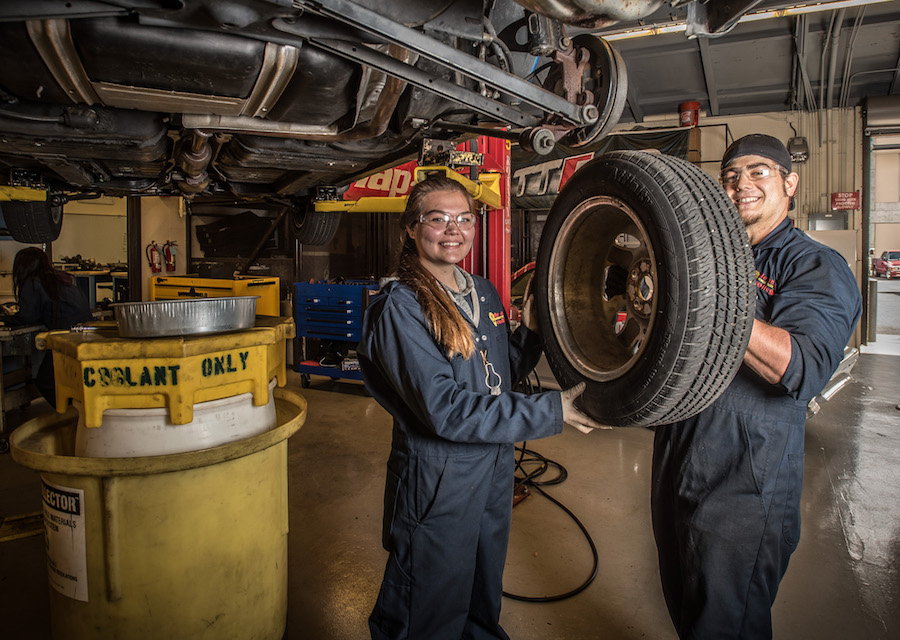 students changing tire