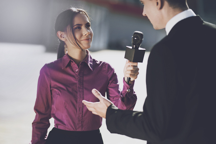 student interviewing man