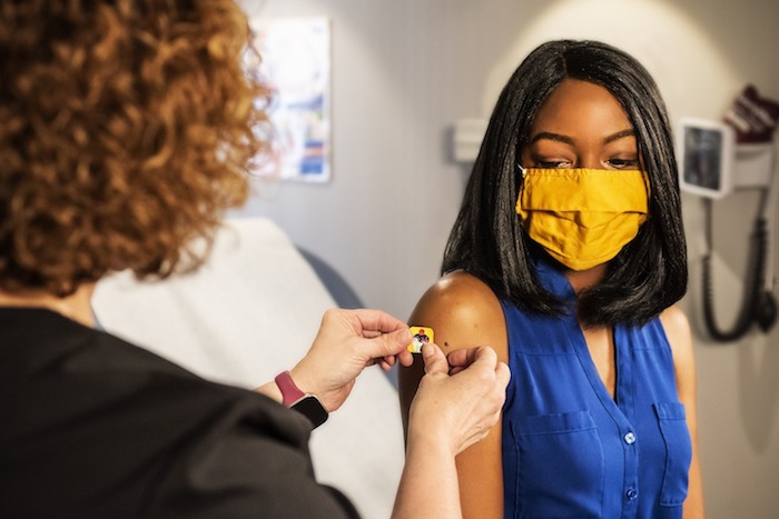 woman getting a vaccine