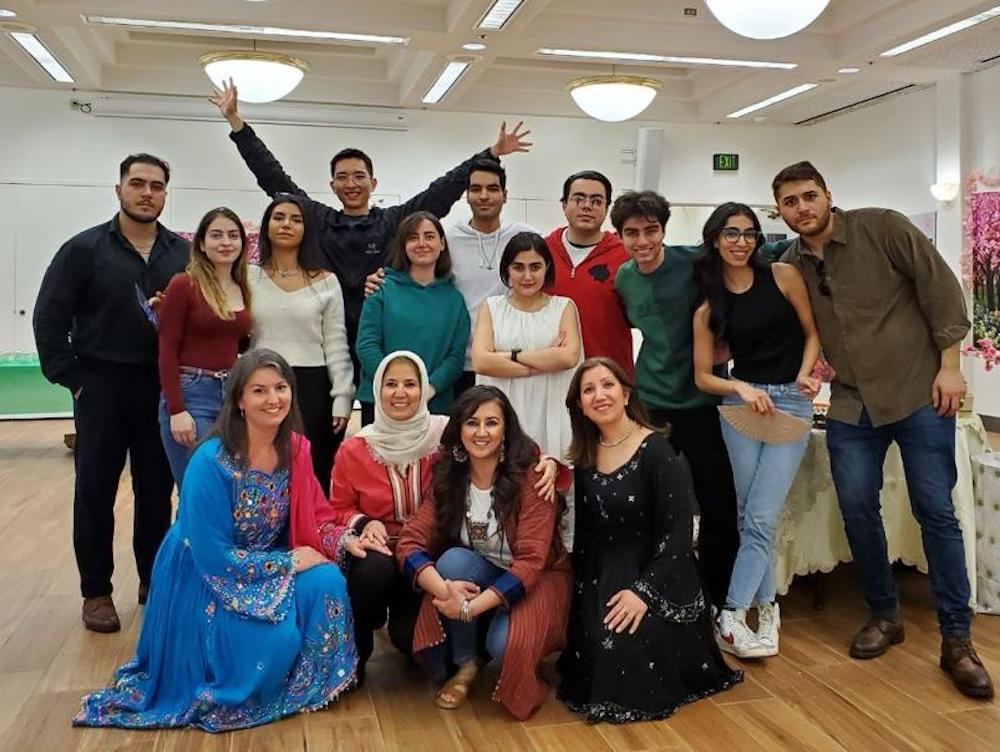 students and faculty members in group after the event