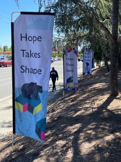 Banners along Stevens Creek Boulevard feature poetry and the word 