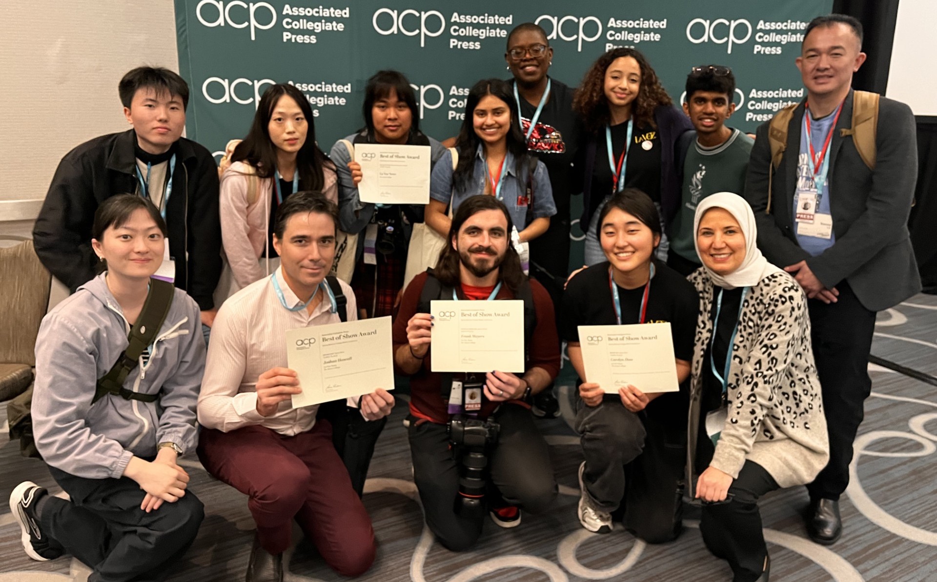 students in group with award certificates