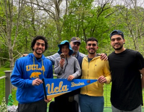 Alwady outside with friends and UCLA pennant