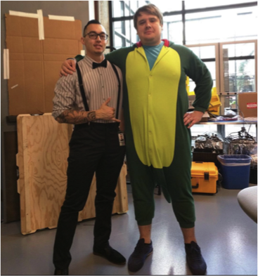 Carmichael in bow tie with friend in onesie