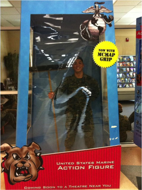 Ho in life-size toy packaging for US Marine action figure