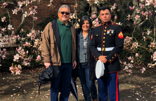 Gabriel Medina in dress blues with man and woman
