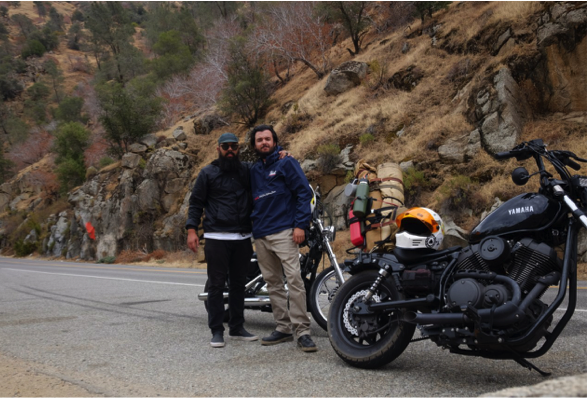 Gabriel Medina with friend in front of motorcycles on mountain road
